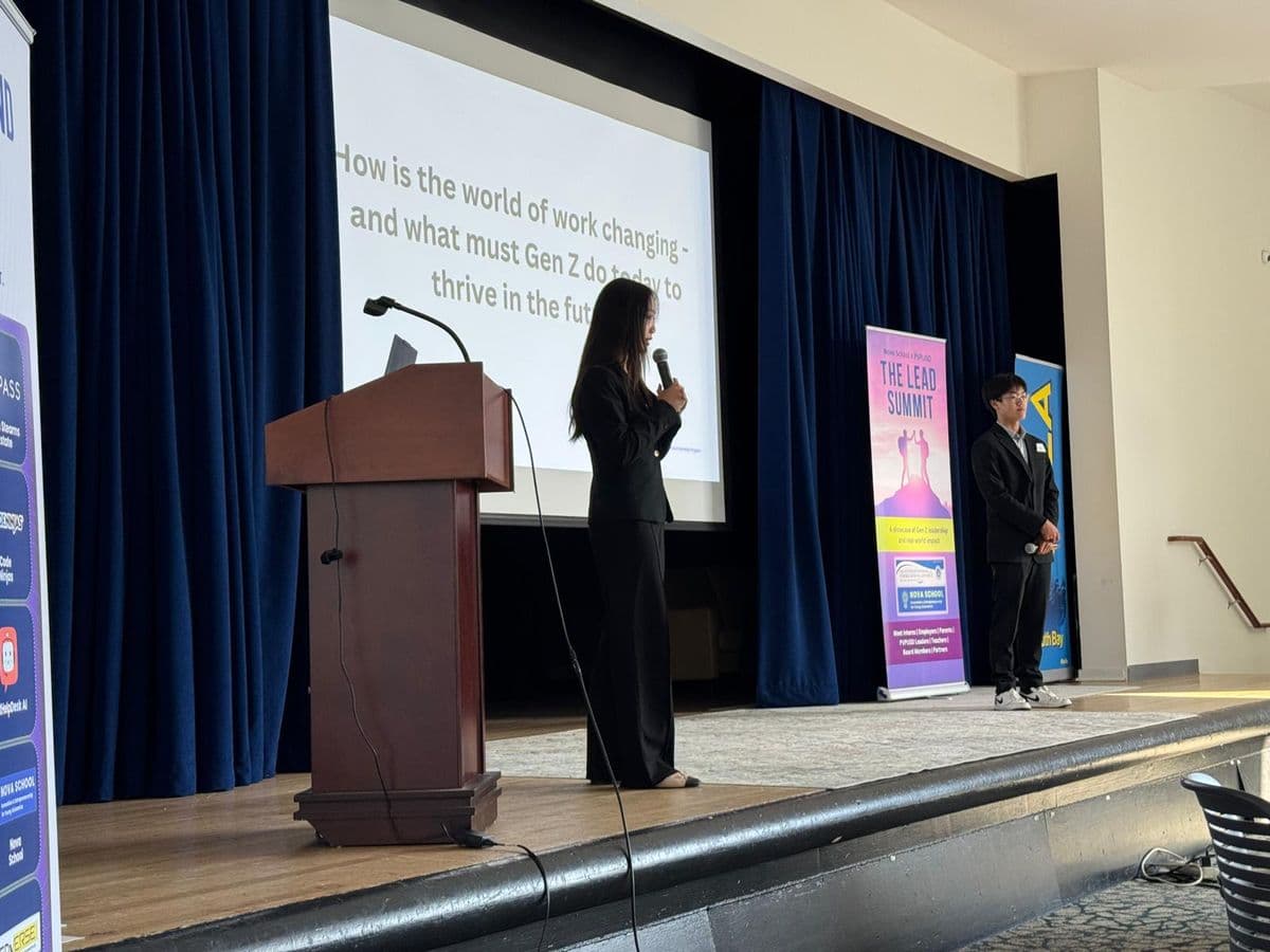 Students presenting on stage